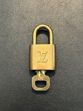 Louis Vuitton Gold Padlock and Key Set
